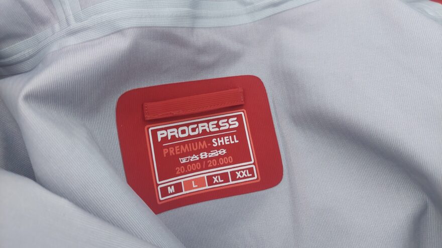 Vnitřní etiketa a poutko na zavěšení - PROGRESS ALPEN JKT